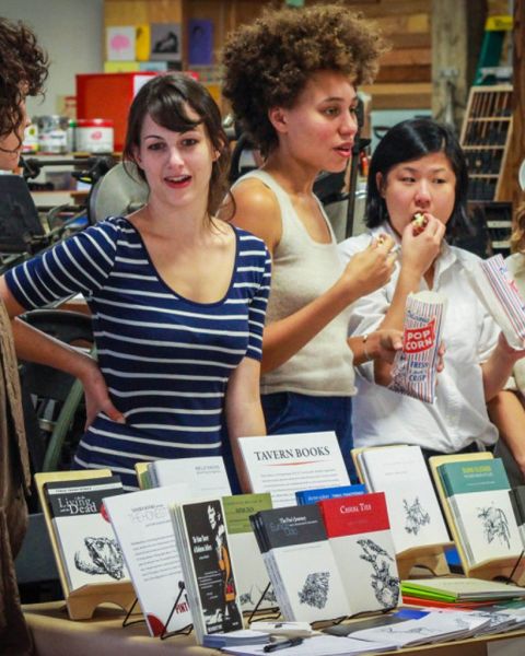 People standing in front of a display of books