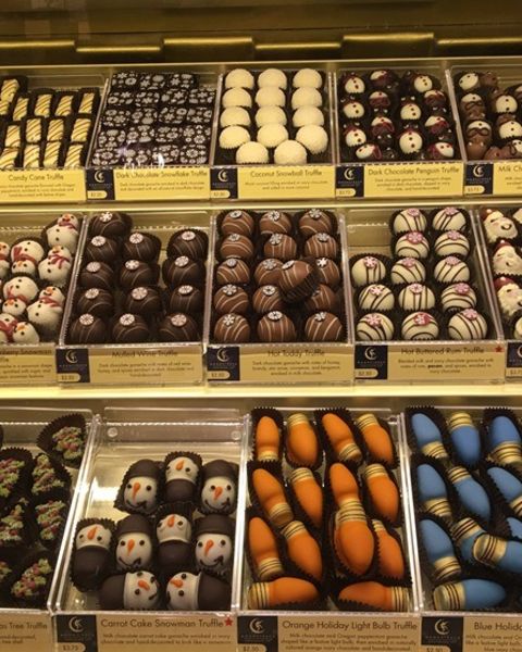 a display case full of a large variety of chocolates