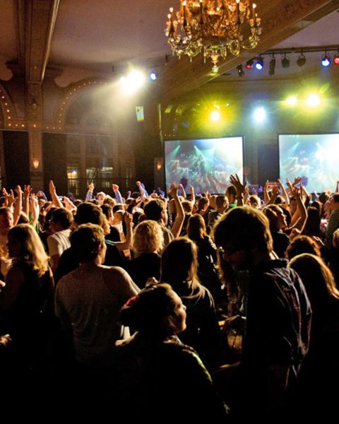 a crowd dancing at a nightclub