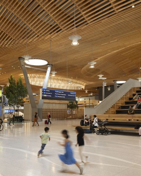 kids running among travelers at airport