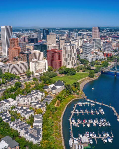 Aerial view overlooking river and city skyline on a sunny day