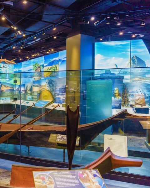 a museum exhibit featuring a wooden canoe