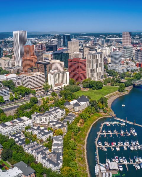 Aerial view overlooking river and city skyline on a sunny day