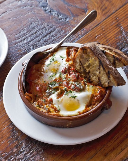 A savory breakfast dish with egg and toasted bread