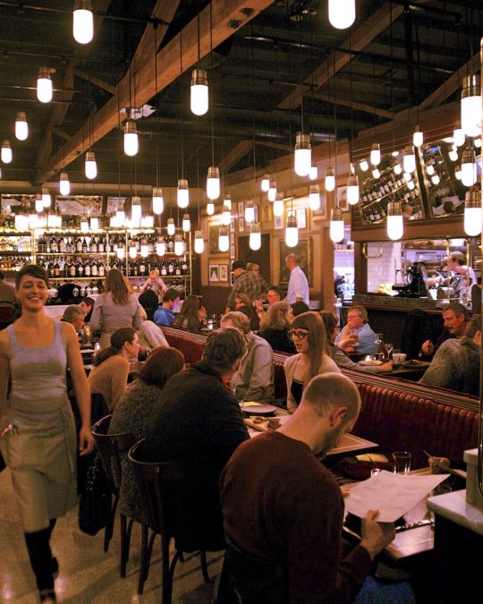 tables at Ava Gene\'s restaurant filled with diners