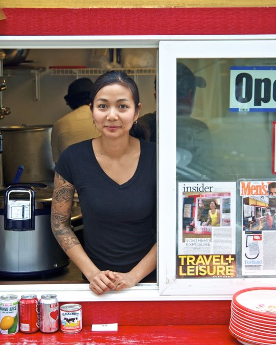 Nong Poonsukwattana, owner of Nong\'s Khao Man Gai, at cart service window.