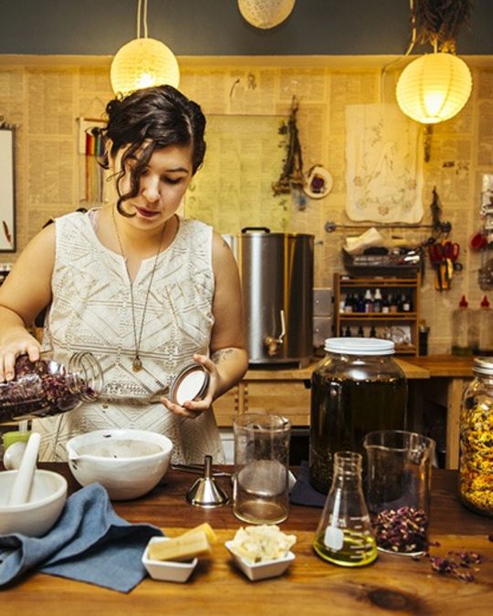 Maria Vashakidze owner of Seagrap, preparing herbs