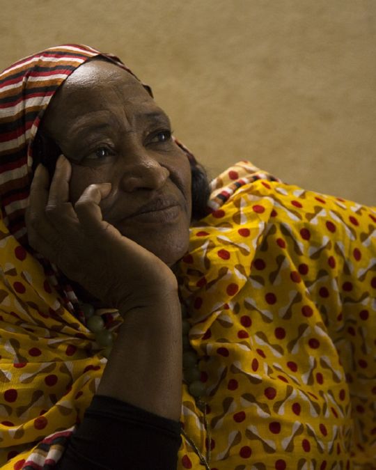 a woman wearing a colorful headscarf