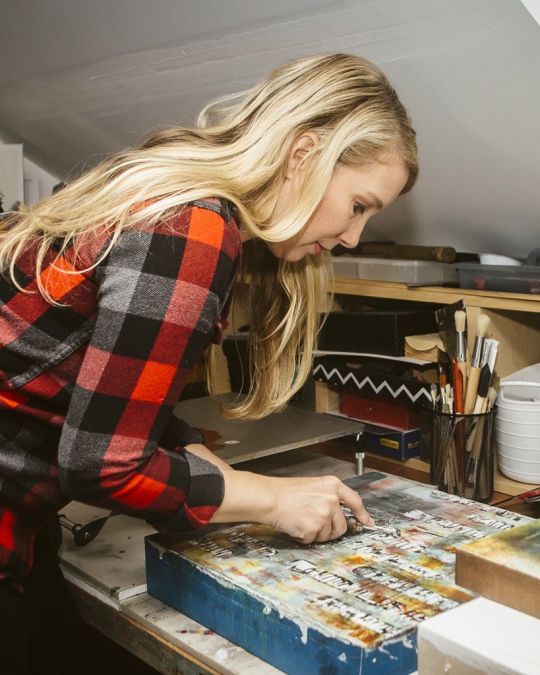 a woman creates art in a studio