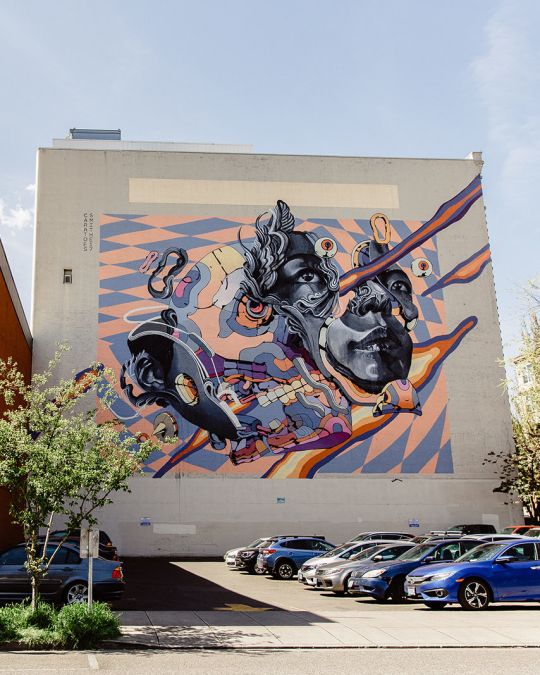 mural on side of building on a city street