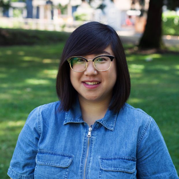 headshot of a person in a park