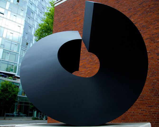 a circular metallic outdoor sculpture