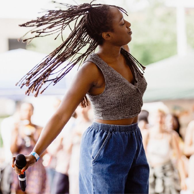 Woman dancing and performing at public event