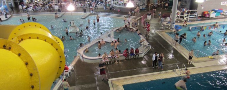 Swimmers beat the summer heat at the indoor North Clackamas Aquatics Center with slides and pools