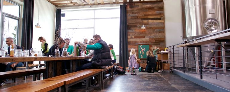 people enjoying beer at a brewery