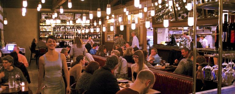 tables at Ava Gene\'s restaurant filled with diners