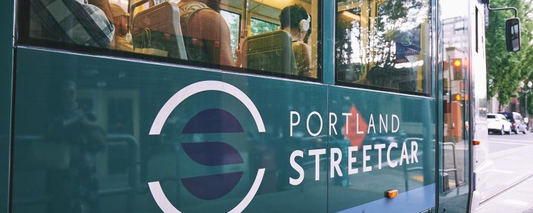people traveling inside the Portland Streetcar