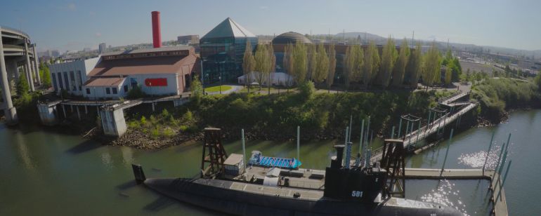 Aerial view of the docked submarine on the Willamette River at OMSI