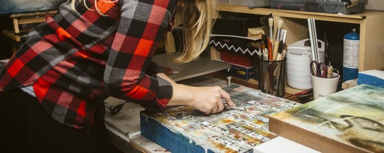 a woman creates art in a studio