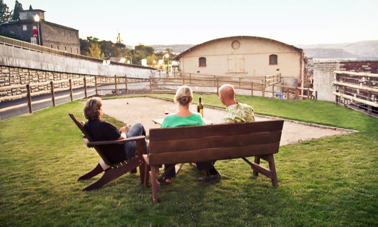 peaple sitting on outdoor benches