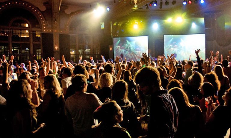 a crowd dancing at a nightclub