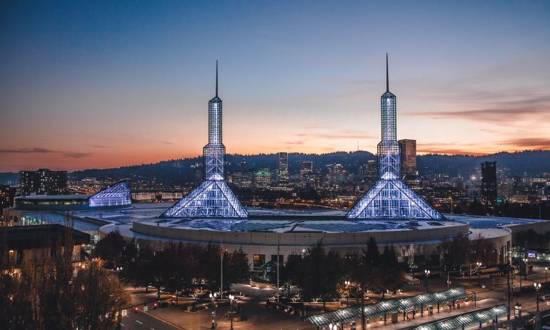 sunset distant landscape view of the oregon convention center and city lights