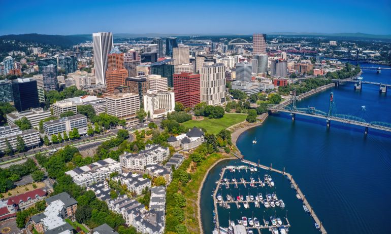 Aerial view overlooking river and city skyline on a sunny day