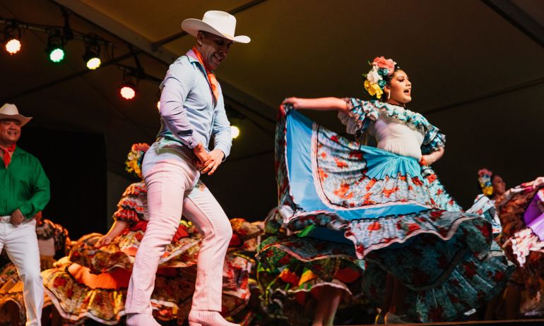 two people dancing on stage