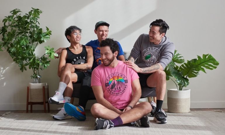 Four People Laughing on a Couch