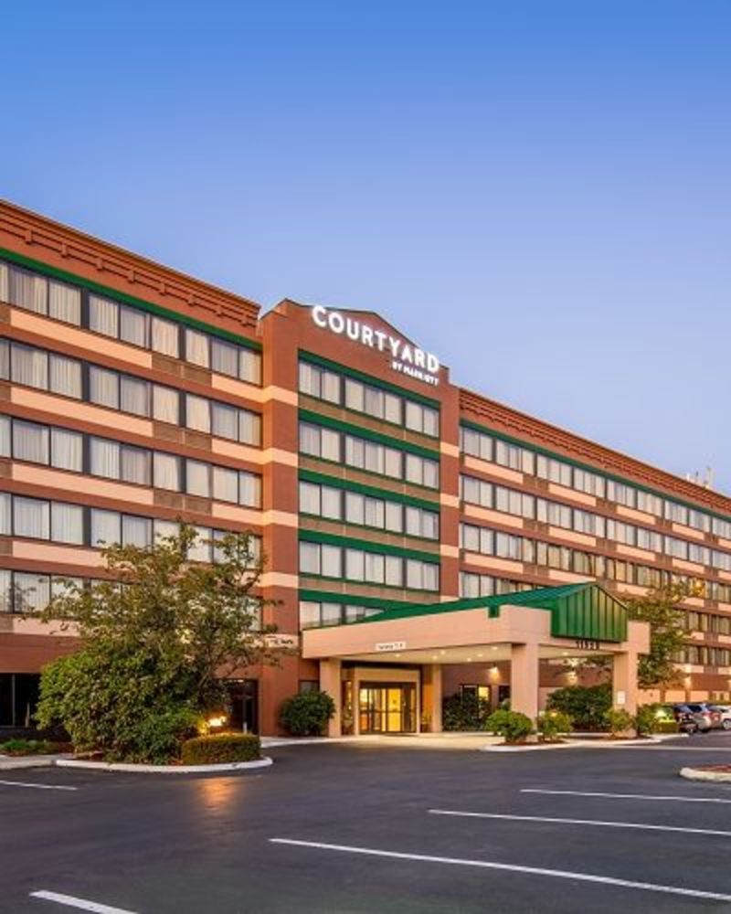 Exterior of the Courtyard by Marriott Portland Airport, a multi-storied building with a covered entrance