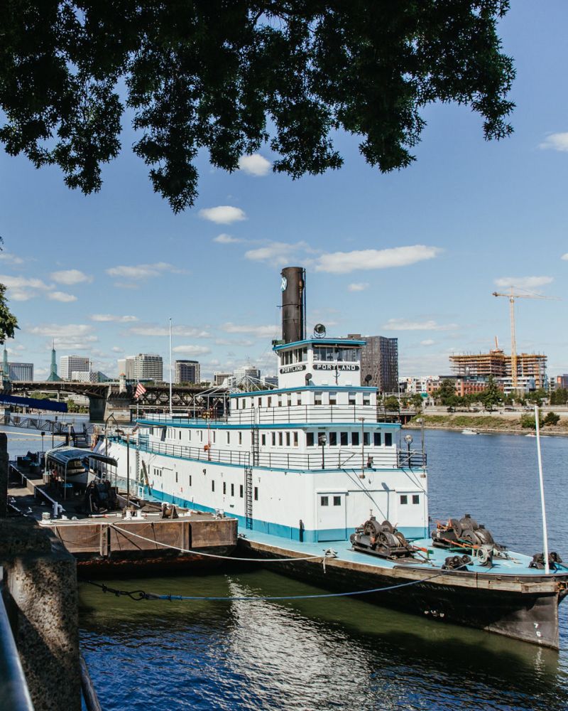 a large steamer boat is docked along the Portland waterfront