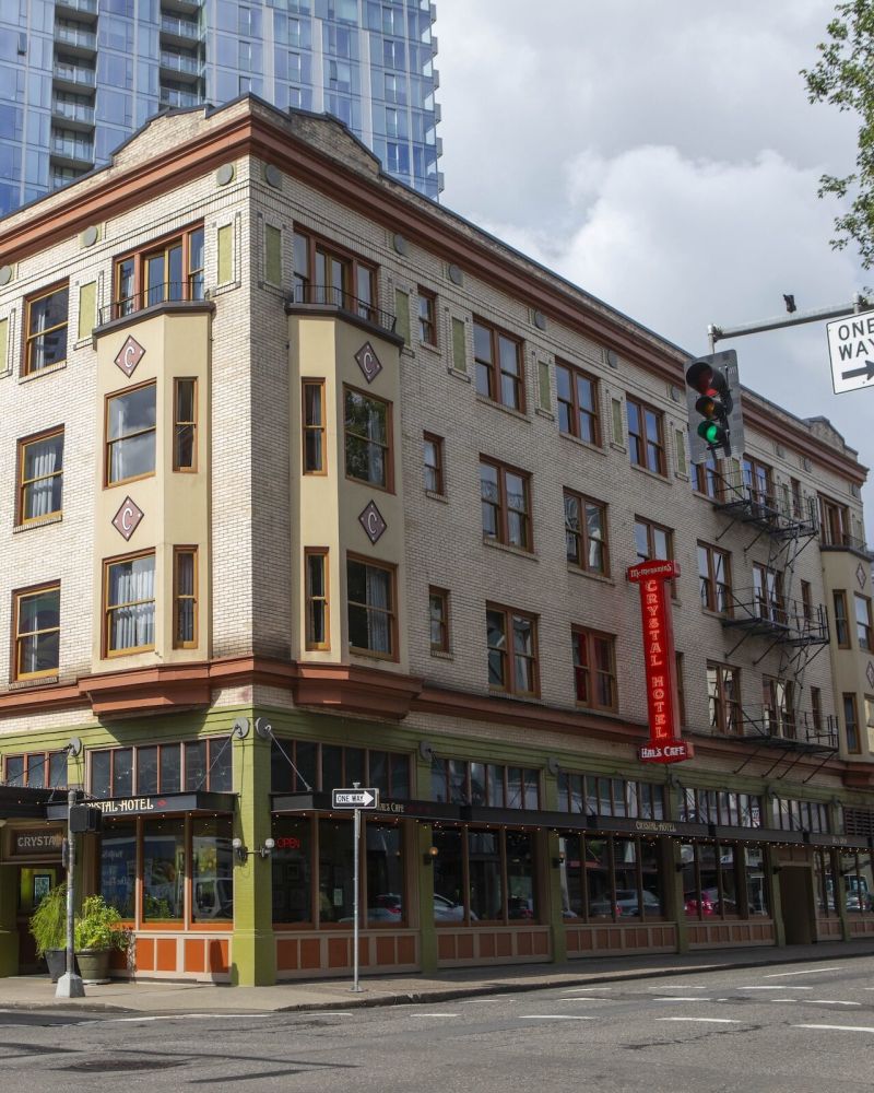 The sunlit exterior of Hal's Café at McMenamins Crystal Hotel