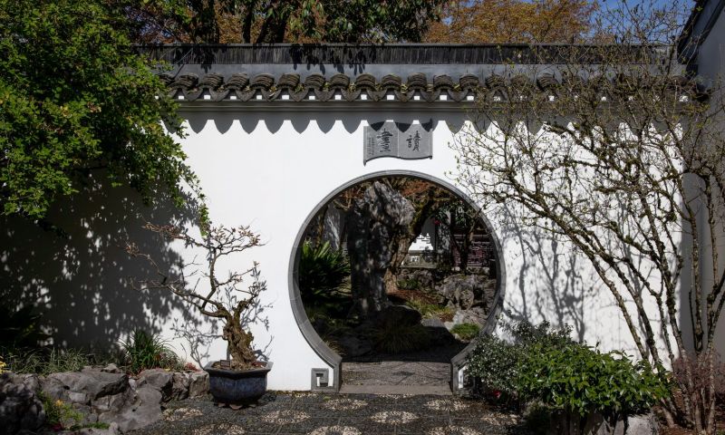 white wall with round gate