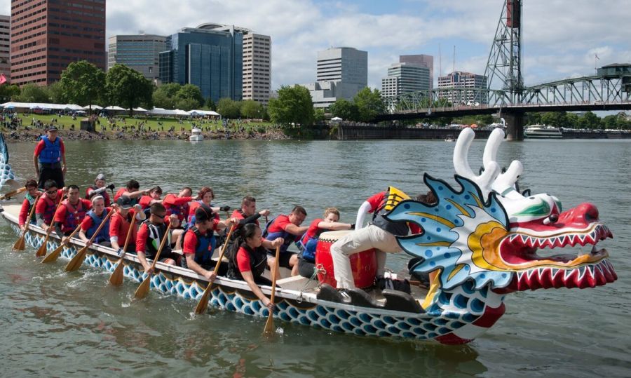 dragon boat with rowers in Wilamette River