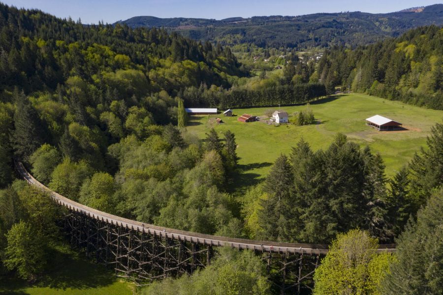 aerial view of the countryside and coastal range with an old rail bridge turned bike and walking path