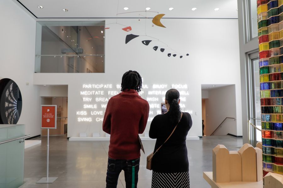 Visitors view an installation at the Portland Art Museum