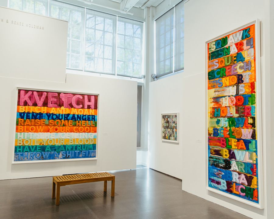 colorful paintings at the jewish museum. one says "KVETCH" in block letters.