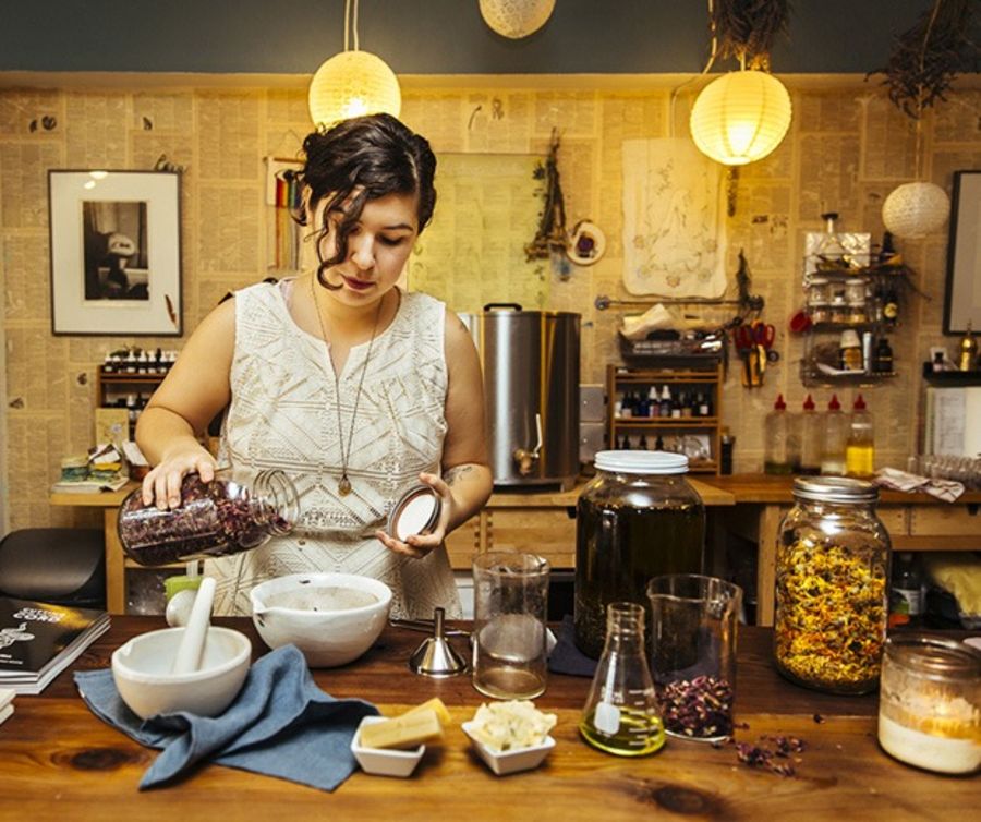 Maria Vashakidze owner of Seagrap, preparing herbs