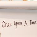 a large pad of paper that says "Once Upon a Time" on it