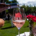 rosé being poured into a wine glass