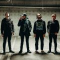 a band standing in a parking garage