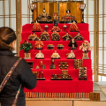 The top tier of a hina doll display features the Emperor and the Empress while the following tiers hold their imperial attendants.