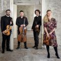 Pavel Haas Quartet holding their instruments.