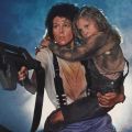 a woman holding a young girl and a big gun