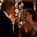 a young woman glares at a man at a party