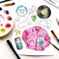 A Baerlic themed watercolor page in the process of being painted, surrounded by a watercolor palette and brushes