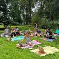 people sitting on blankets and painting