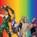 drag queens in front of a rainbow background