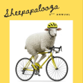 a sheep in a helmet riding a bicycle