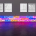 a neon sign depicting words in the natural world
